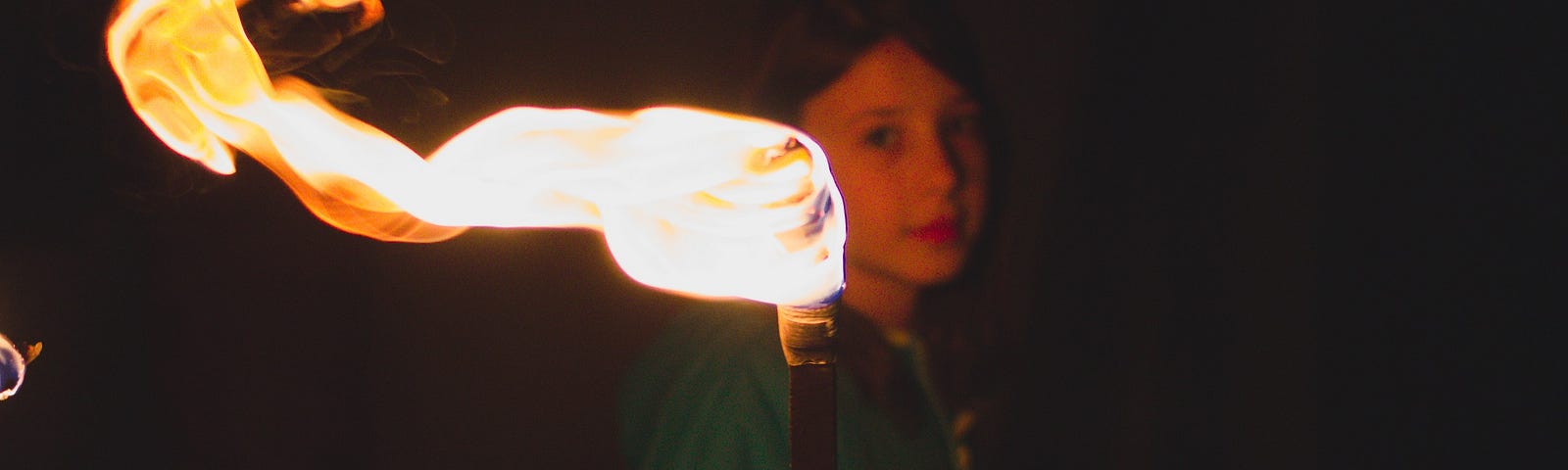 girl holding a torch