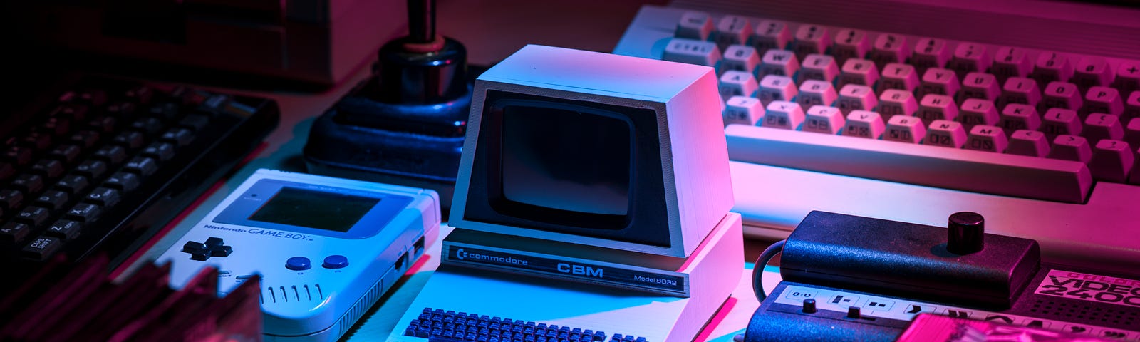 A collection of old computers and gaming console