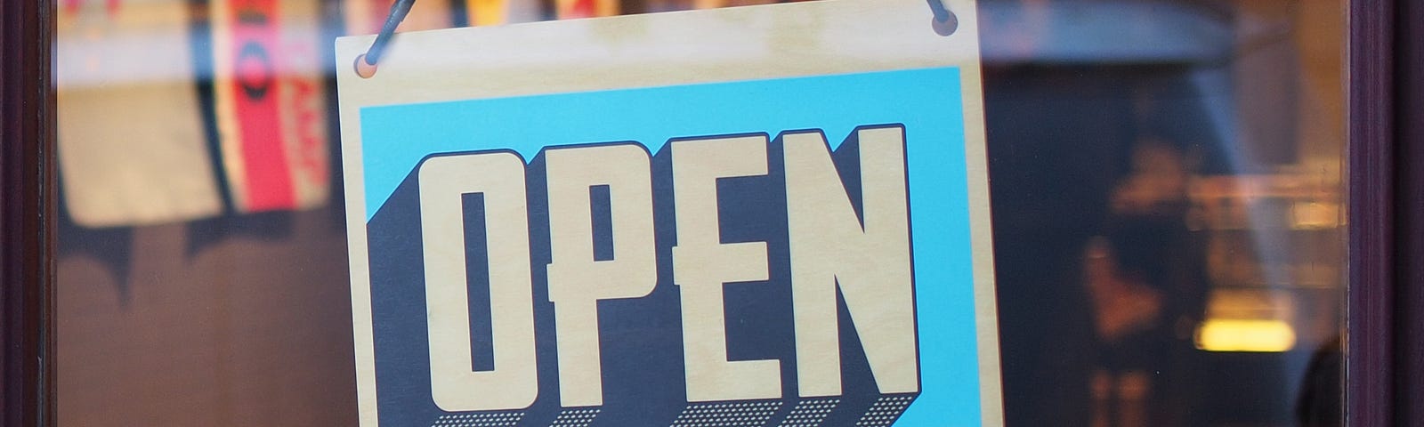Store door with an “open” shop sign