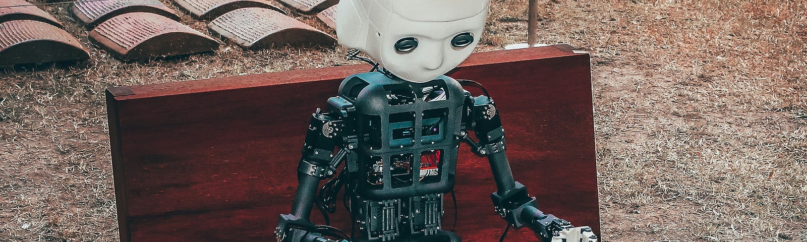 Humanoid robot reading a booklet