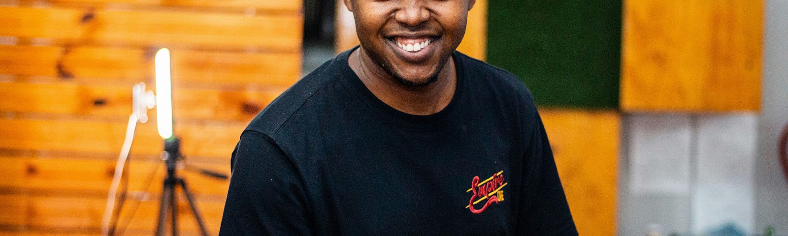 Smiling waiter carrying a food tray