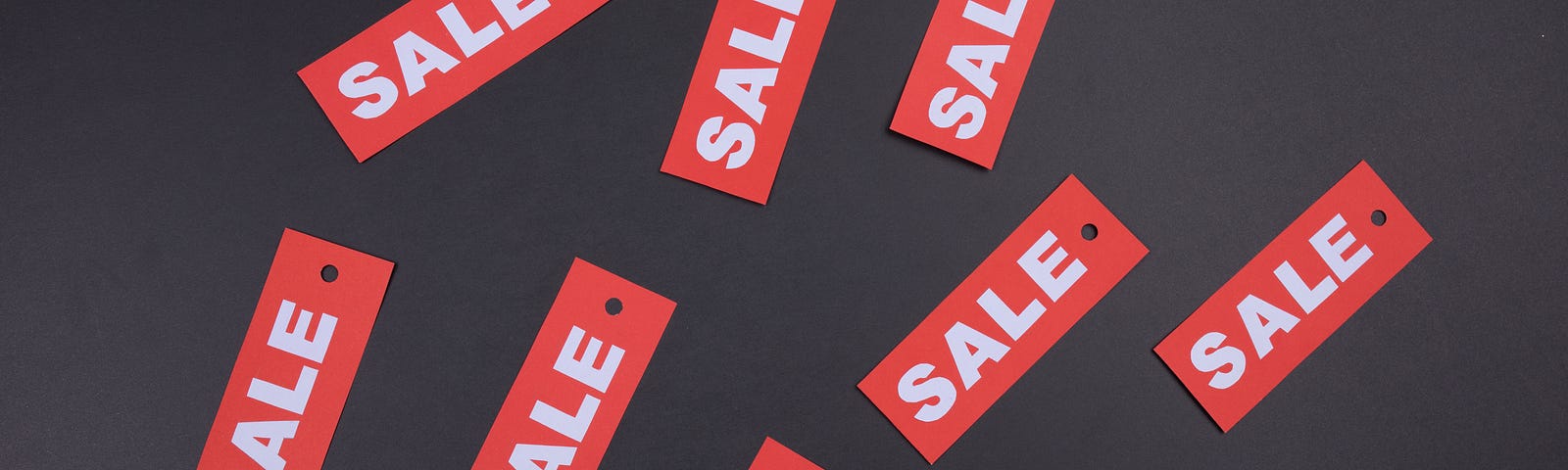 Red tags with the word SALE written in white.