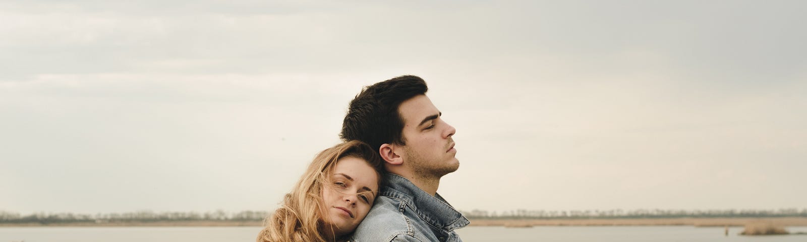 A boy and a girl standing close to each other