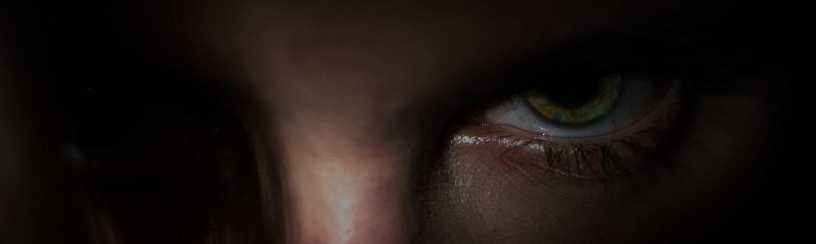 Close-up of man with menacing eyes.