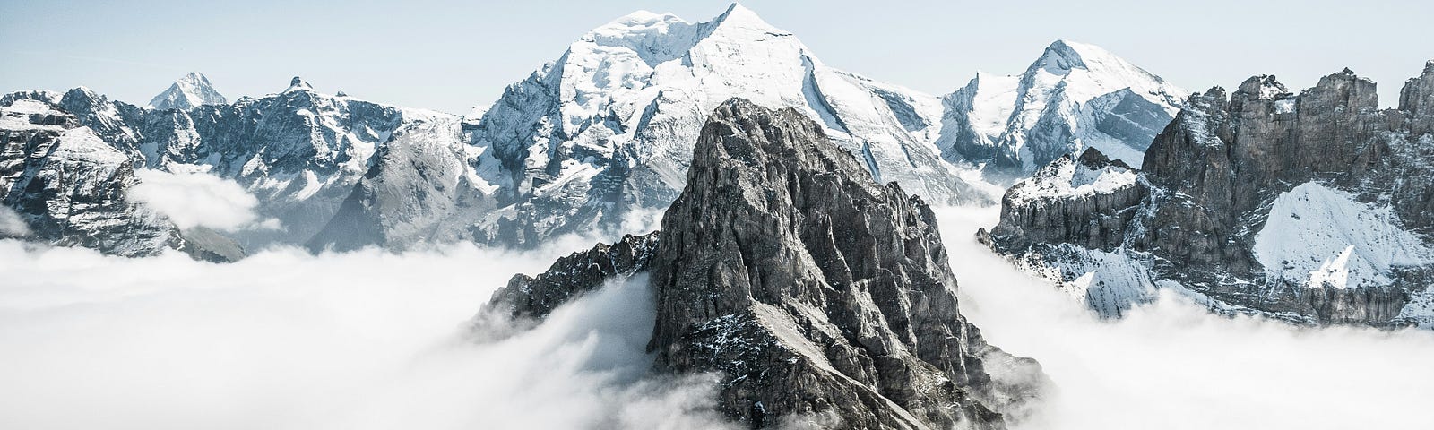 Peaks of grey and white mountains sticking out of the mist. I let my mind sooar there.