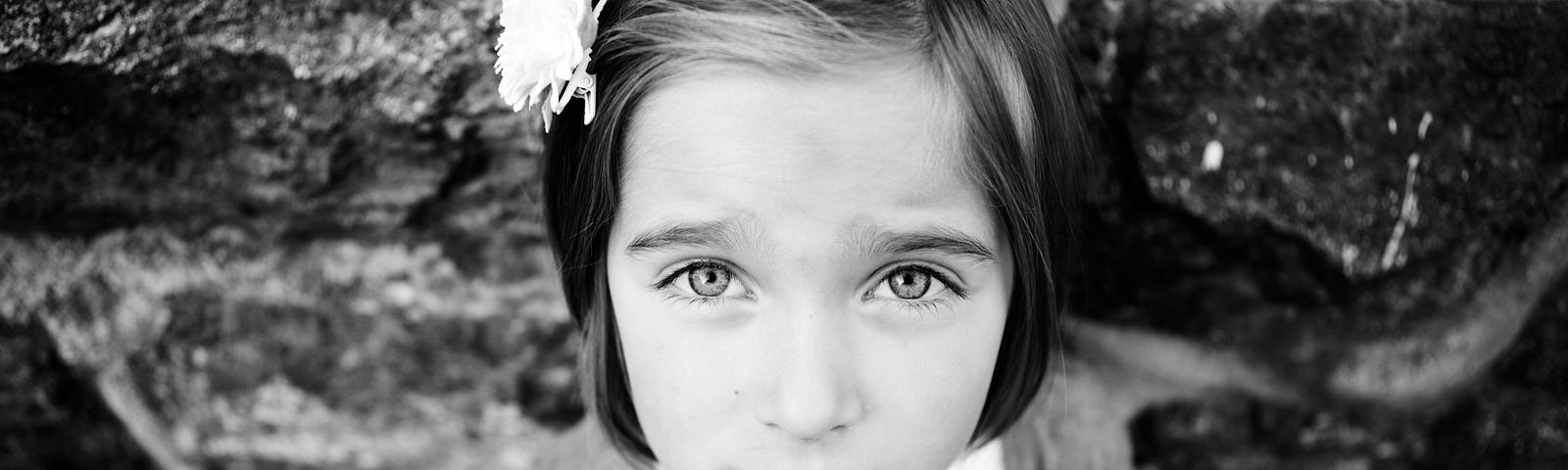 Picture of a young girl looking puzzled and concern