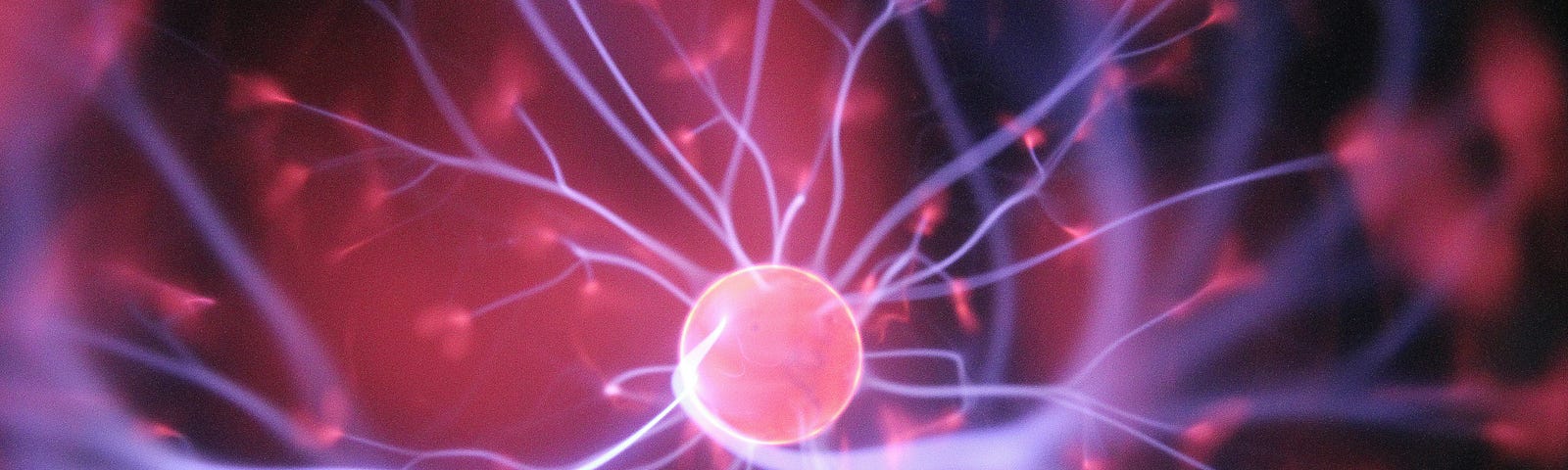 Simulated pink brain cell against pink and black background.