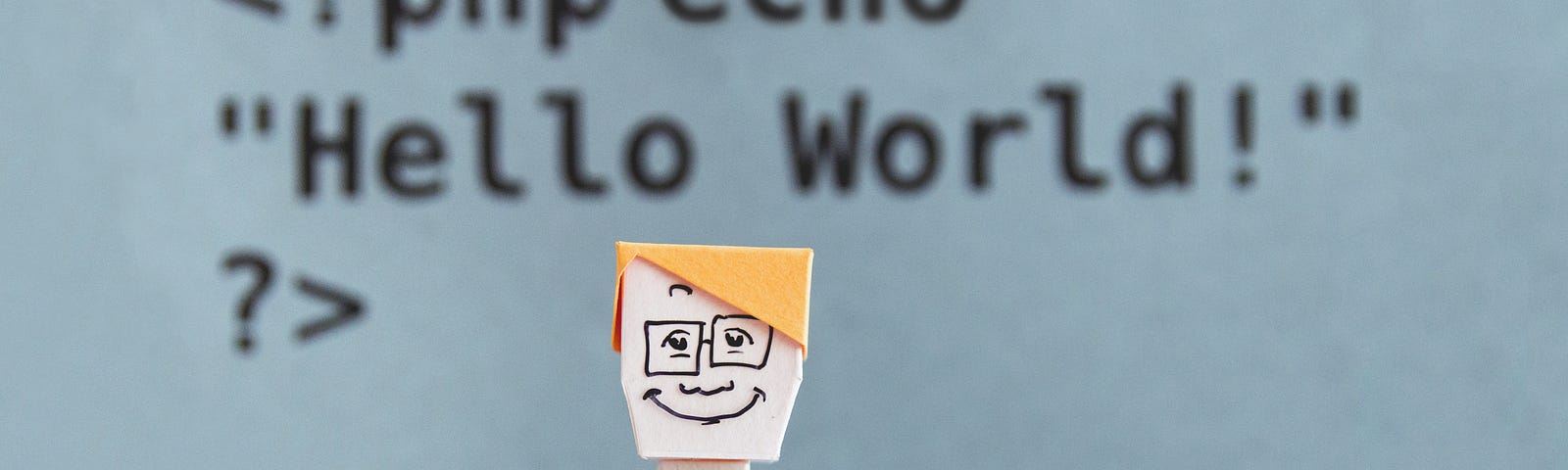 Paper person in foreground with code in background