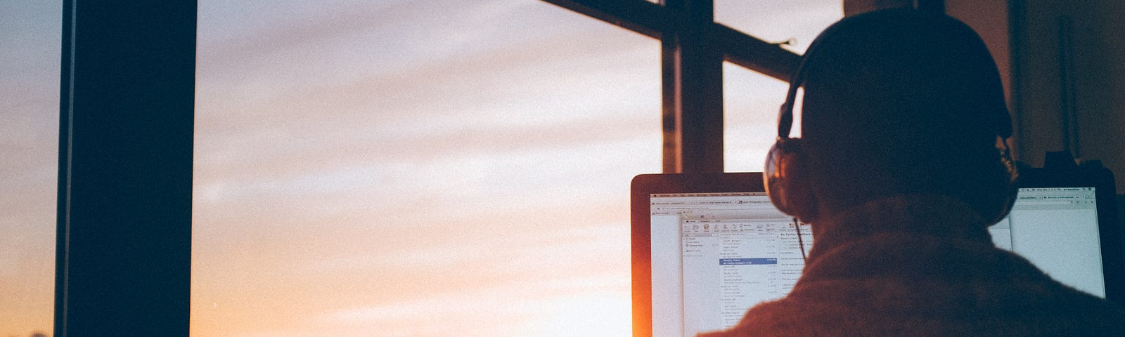 work for yourself; image of a guy sitting at his window on his computer