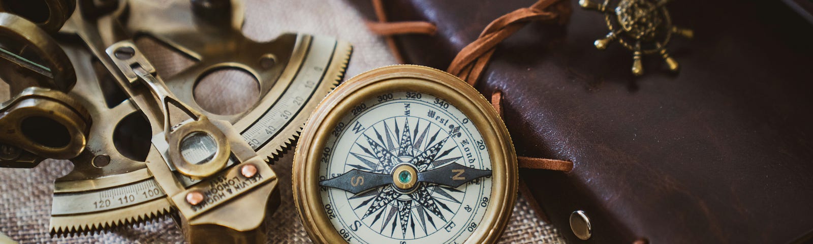 compass among other navigation tools: spyglass, sextant, shops log.