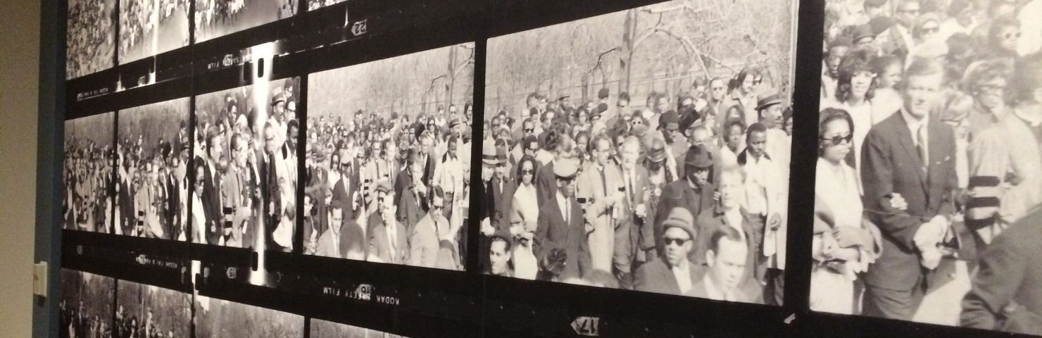 A series of black-and-white images from film negatives depicting Mayor John Lindsay’s peaceful march through New York City following the shooting and death of Dr. Martin Luther King Jr.