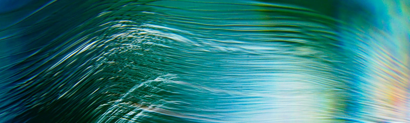 Wavy lines going from left to right against a background in shades of blue