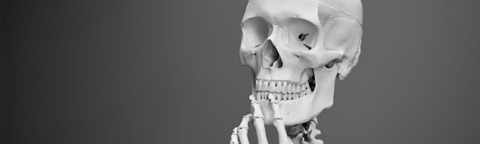 skeleton in a thoughtful pose