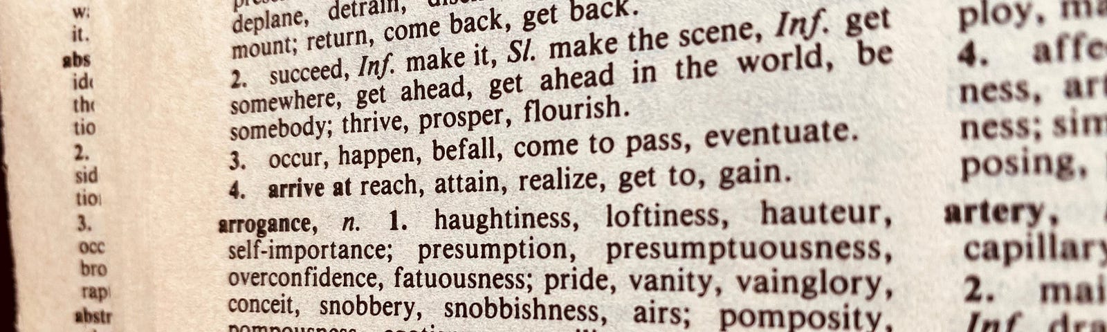 The image of a page from the A section of a thesaurus, focused on “arrogance.” Synonyms include: haughtiness, loftiness, self-importance, presumption, overconfidence, pride, vanity, vainglory, conceit, snobbishness, etc.