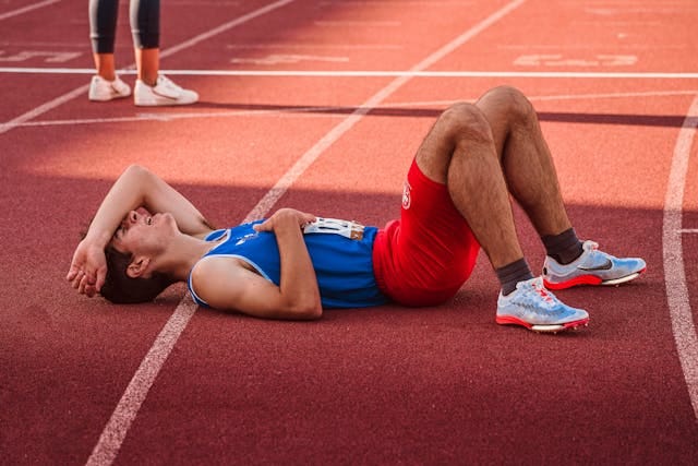 An athlete suffering at the end of his race.