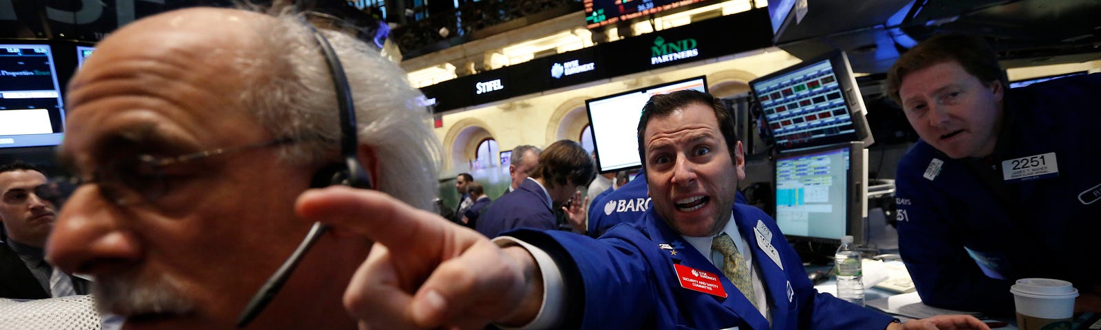 Barclays specialist trader Michael Pistillo shouts out a price just after the opening bell on the floor at the New York Stock Exchange, March 15, 2013. REUTERS/Brendan McDermid (UNITED STATES - Tags: BUSINESS) - RTR3F1A6
