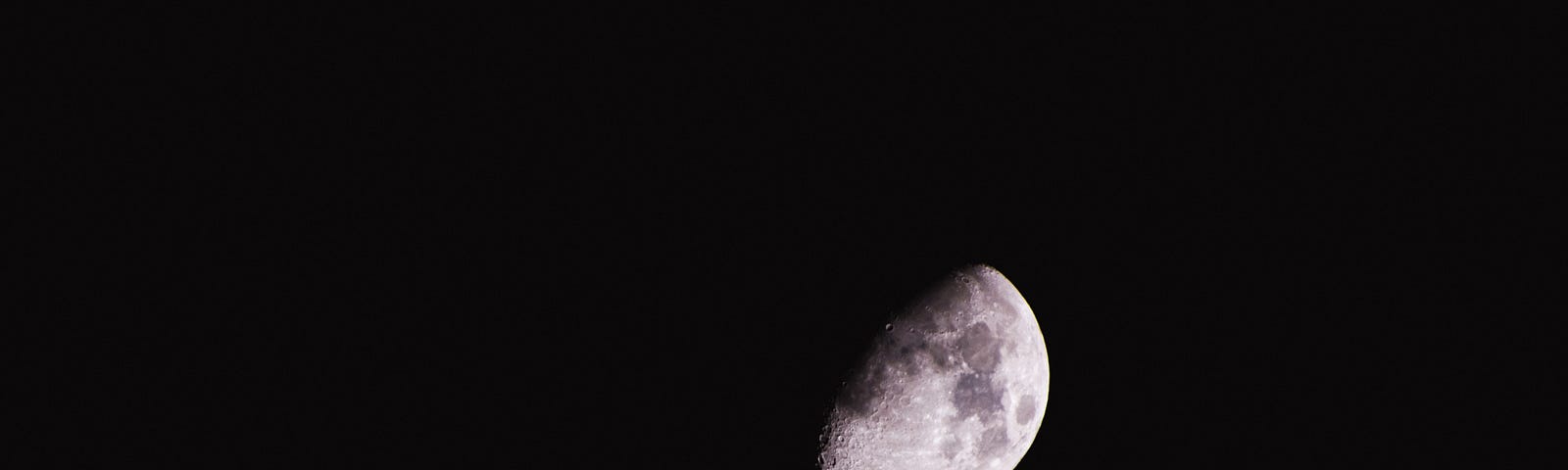 picture of a waning gibbous moon using a telescope.