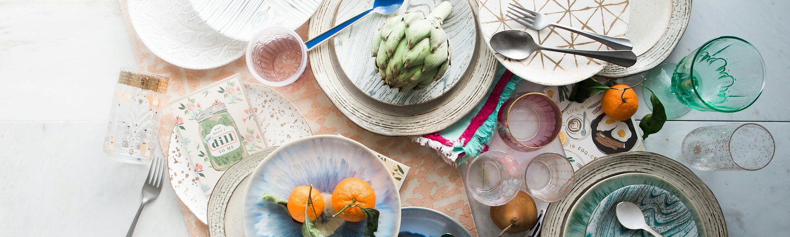 Several dishes on a table containing exotic foods