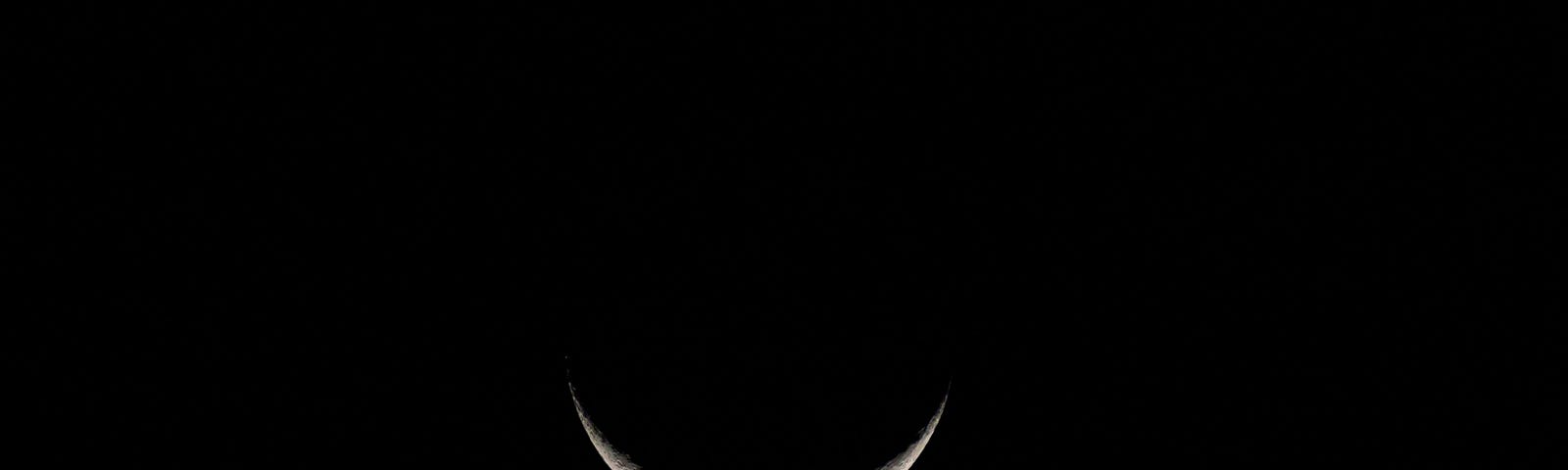 Beautiful crescent moon and a dark sky