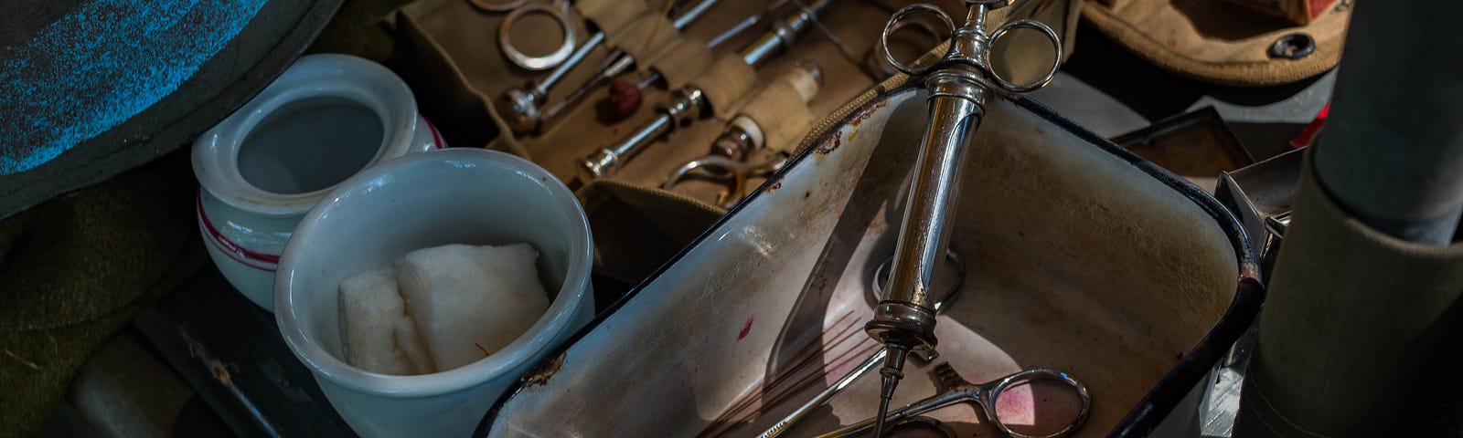 scalpel, gauze, and surgical tools on a tray