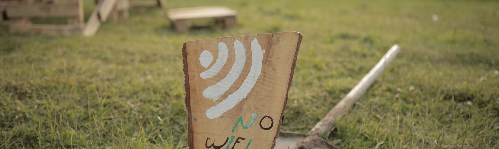 A sign in a yard that says “No WIFI Zone” — Unsplash