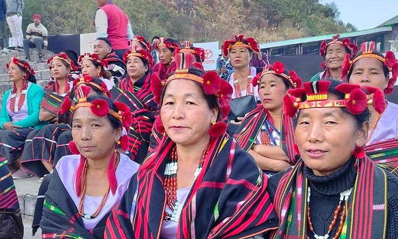 Sumi-Naga women dressed and seated in their traditional attire at the Hornbill Festival. Photo: Penuo Hiekha