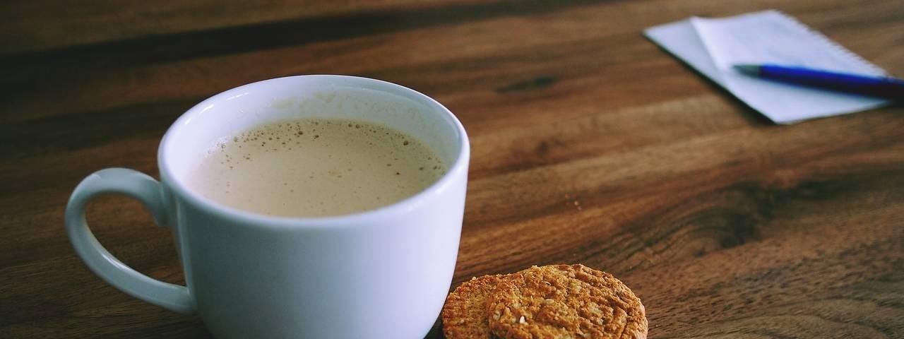 cappuccino with cookies on a wooden table