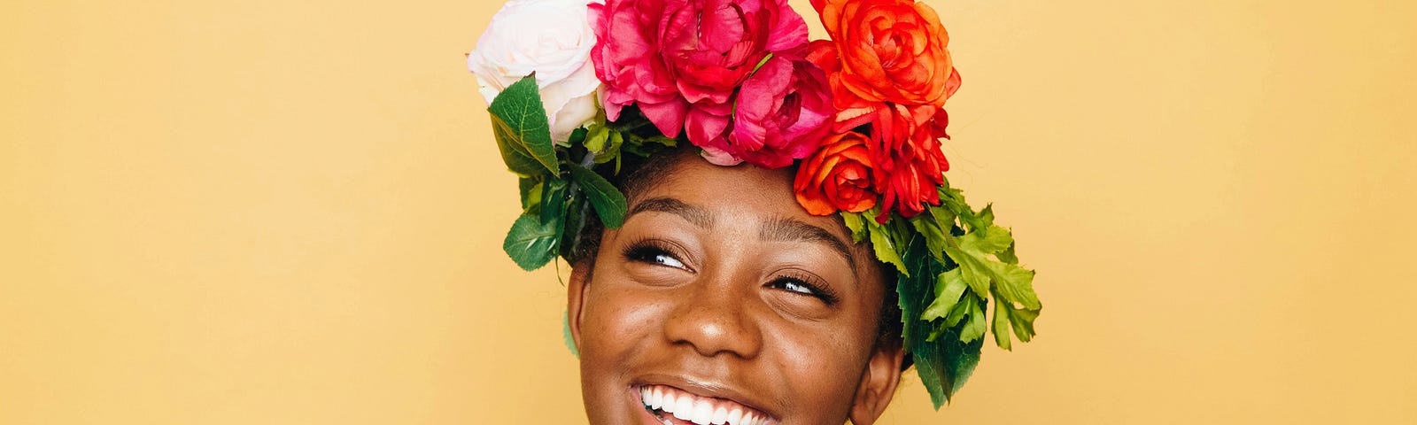 A black woman with a flower crown