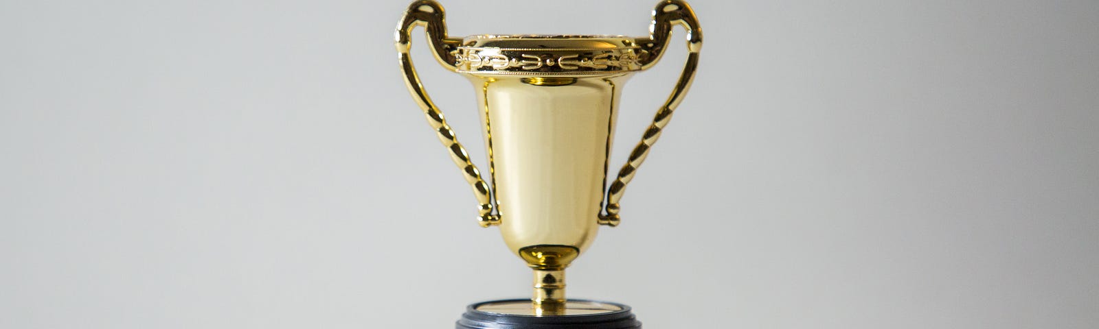 gold winner’s cup on white background