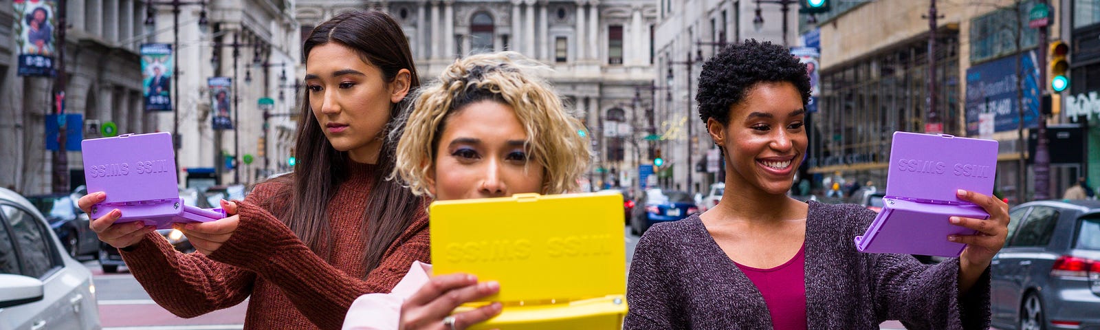 Confident women looking at tablets.