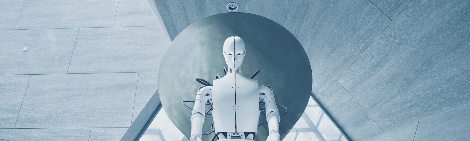 White android sitting cross-legged above wires against geometric background