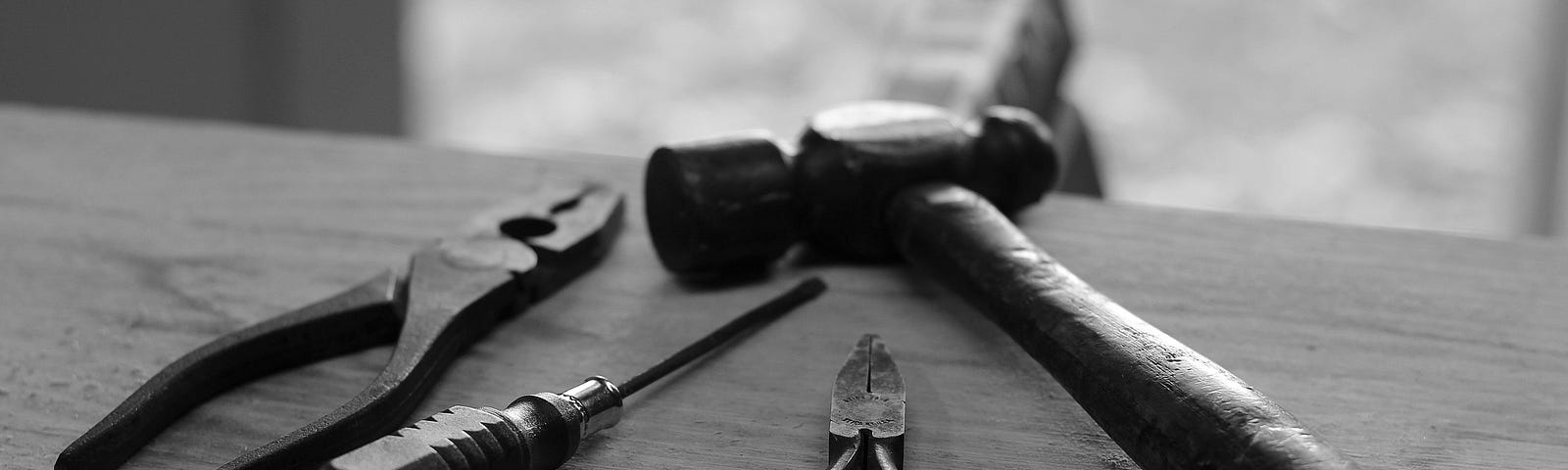 A photo of some tools on a workbench to represent workers
