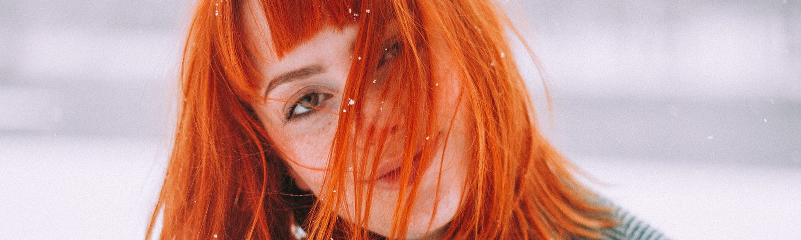 portrait of a young woman with red hair.