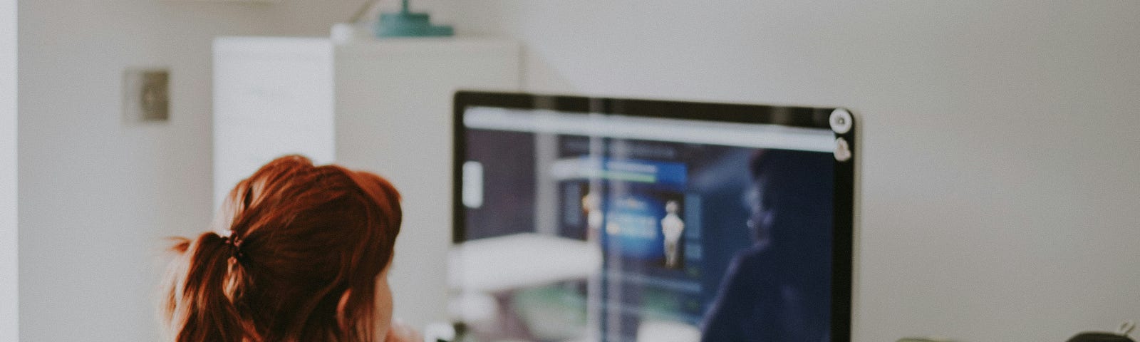 Woman working at Computer in hte workplace