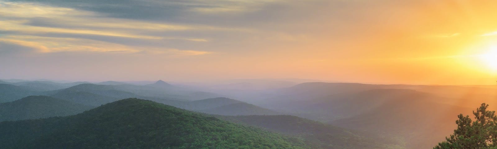 The view west from Flatside Pinnacle across the Ouachitas toward Forked Mountain at sunset.