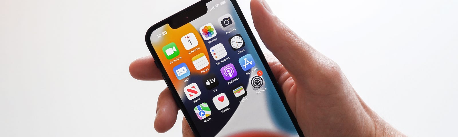 iPhone 12 in a person’s hand