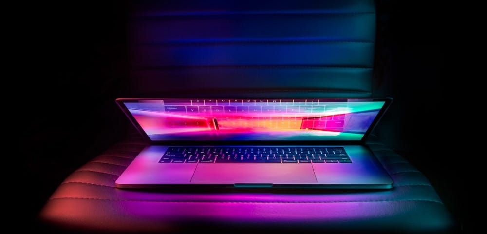 Half-open laptop on desk chair