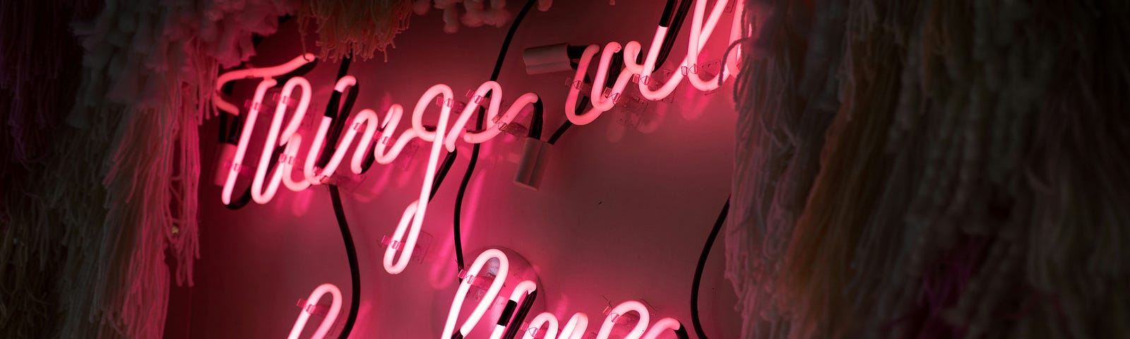 A red neon sign with the lettering “things will be fine.”