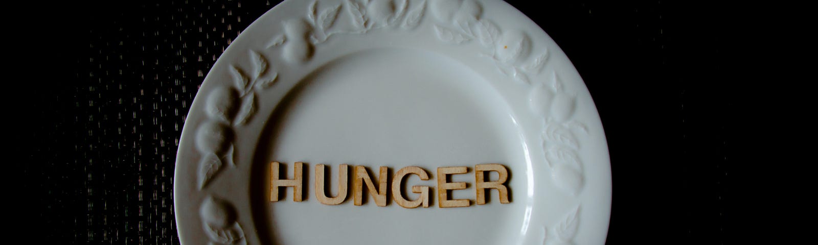A plate with the word Hunger written on it.