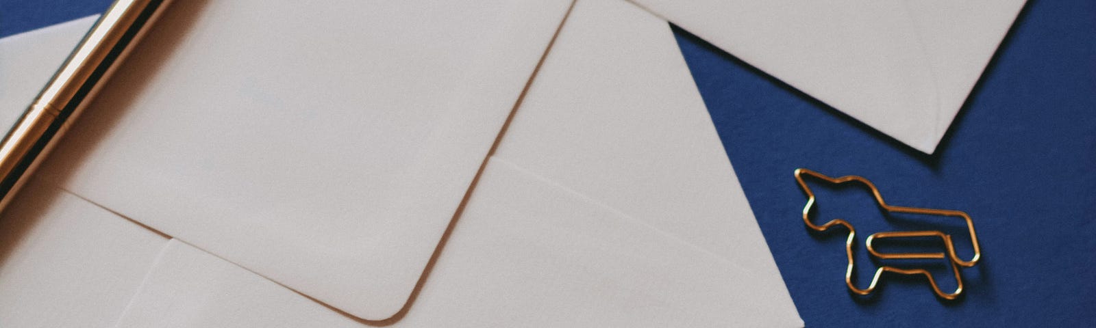 letter envelopes on a blue desk