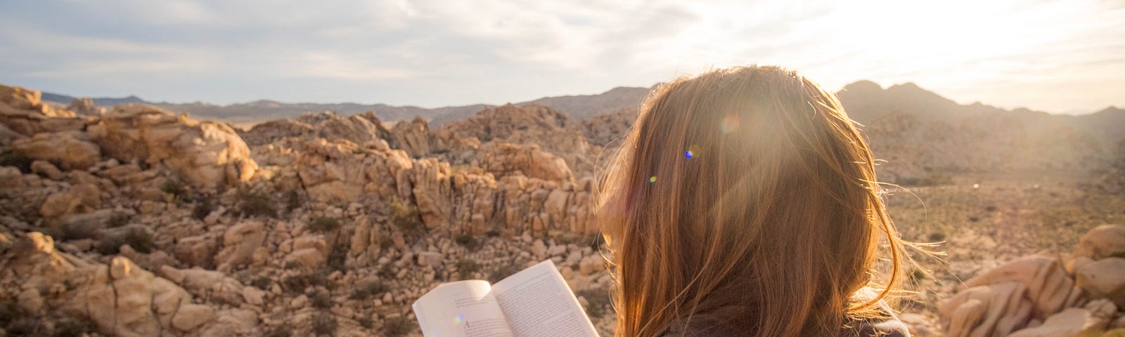 Image of woman reading in the mountains for 5 Books that Changed my Life 180°
