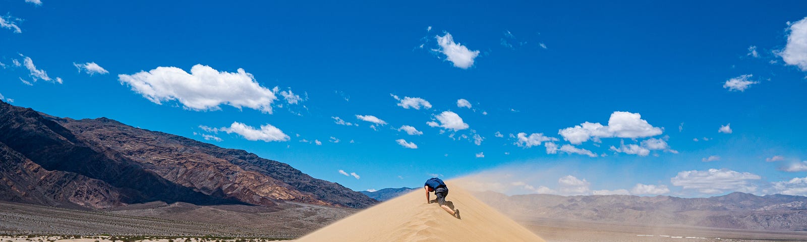 a guy in the desert sand