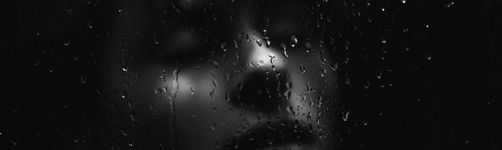 Artsy pic of rain-covered glass in front of sad person’s face. Play the version of Mad World from Donnie Darko, and you’ll get the vibe