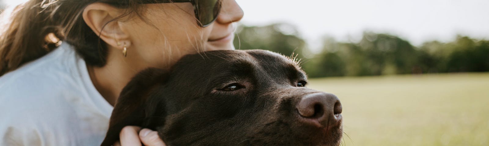 woman hugging a dog