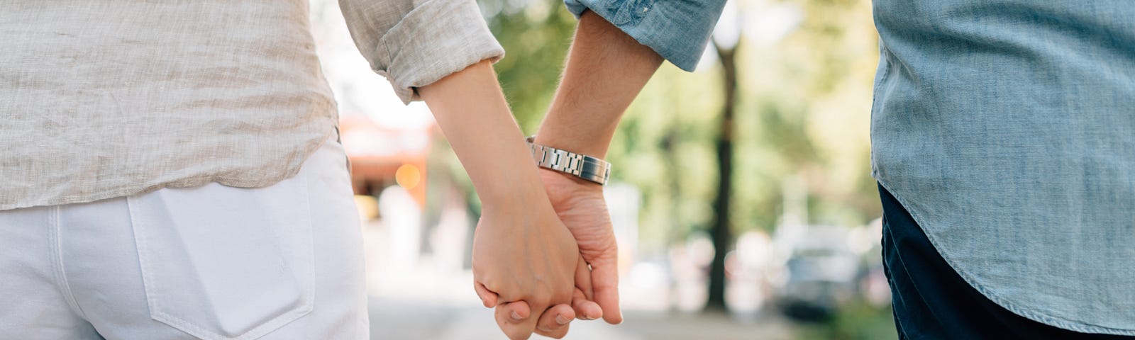 Couple holding hands