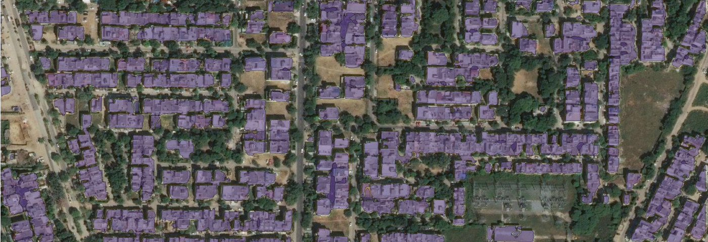 a satellite image with building footprints polygons drawn on the buildings