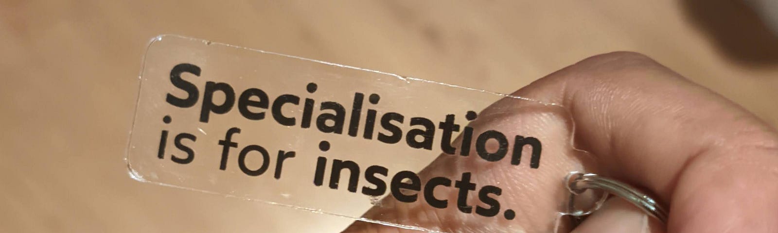 A keyring saying ‘Specialisation is for insects’