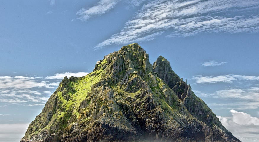 Photo of an island with a clear blue sky