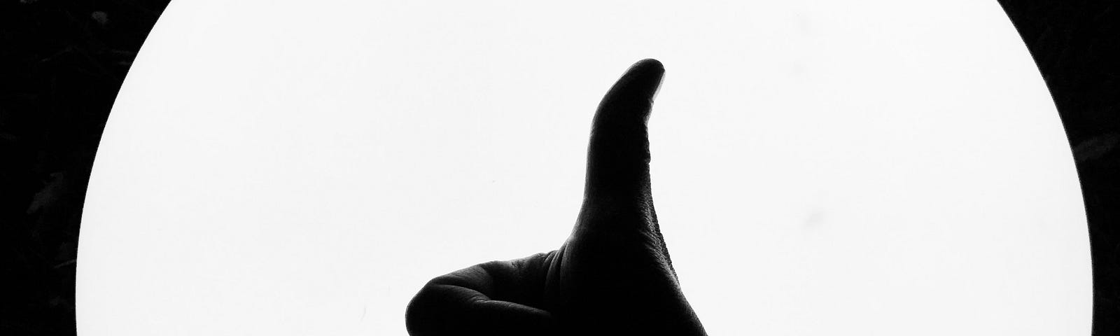 A silhouette of a thumbs up, which is what I give your story when reviewing it!