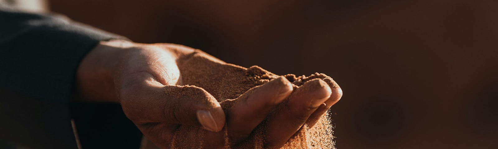 Here is an image of sand slipping through a man’s finger, representing time slipping by and our need to recognize the precious time given to each of us and use it wisely.